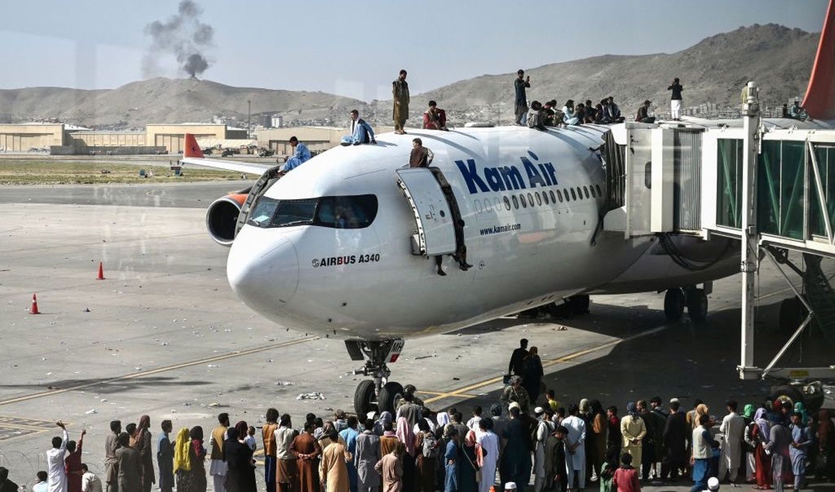 BREAKING: U.S. Suspends Flights At Kabul Airport After Afghans Swarm Runway, Cling To Departing Planes | The Daily Wire